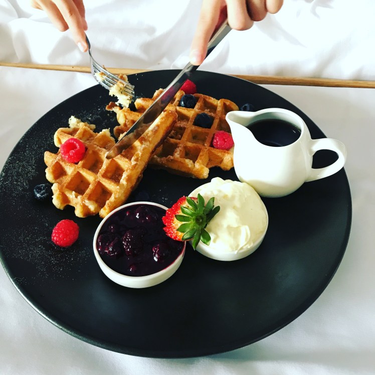 belgian waffles , mixed berry compote, maple syrup, chantilly cream